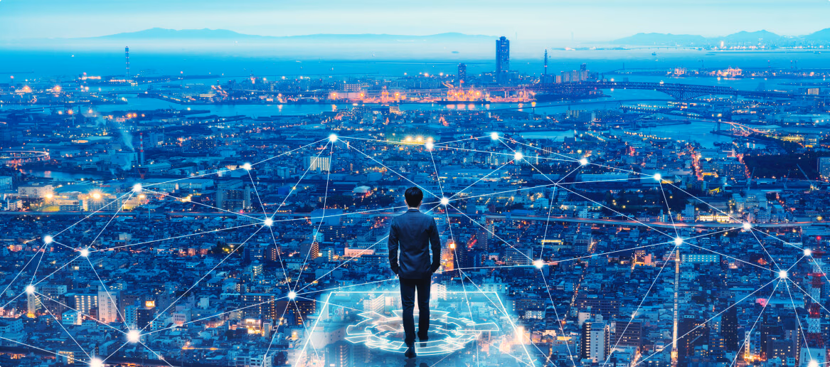 Man standing in front of a digital cityscape